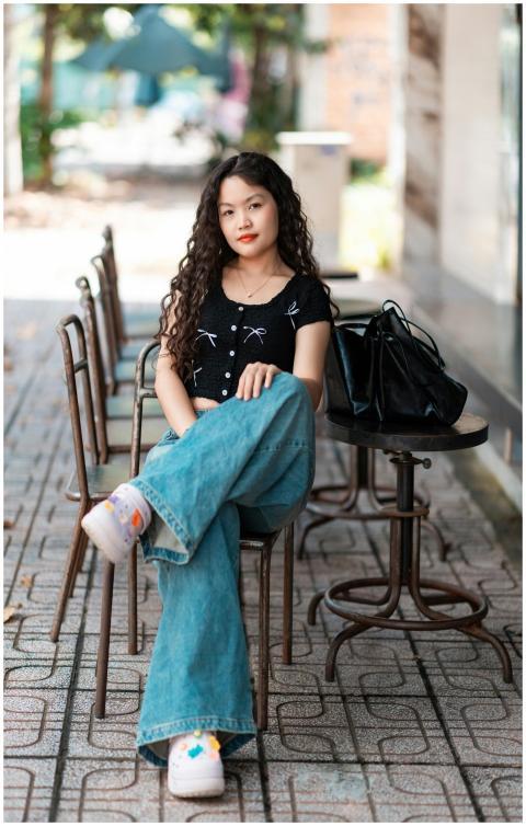 Stylish Woman Sitting Outdoor