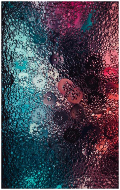 Vibrant macro shot of colorful water droplets on a