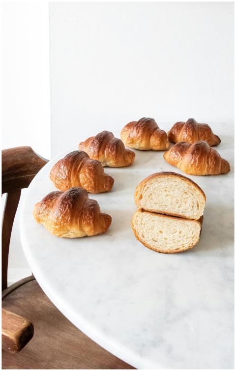 Delicious homemade croissants on a marble table, s