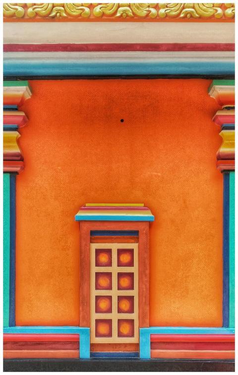 Bright multicolored architectural wall with door s