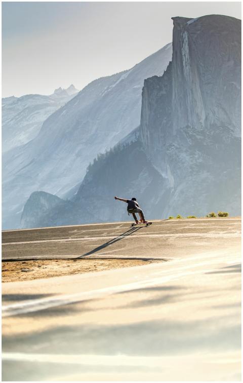 Dynamic shot of a skateboarder cruising with Yosem