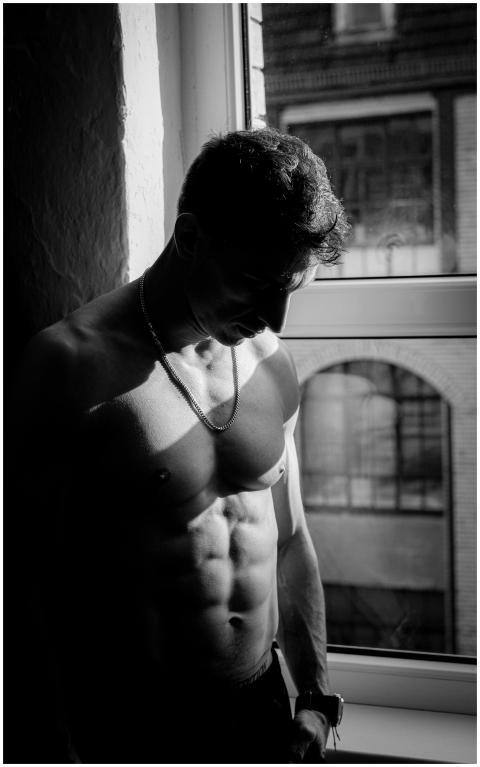 Black and white portrait of a muscular man in Berl