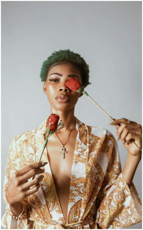 Stylish portrait of a woman holding red roses, sho