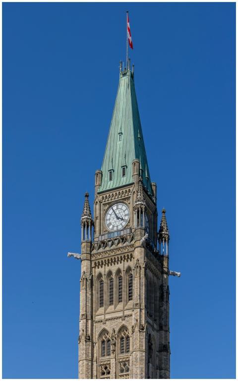 The iconic Peace Tower in Ottawa, Canada, stands t