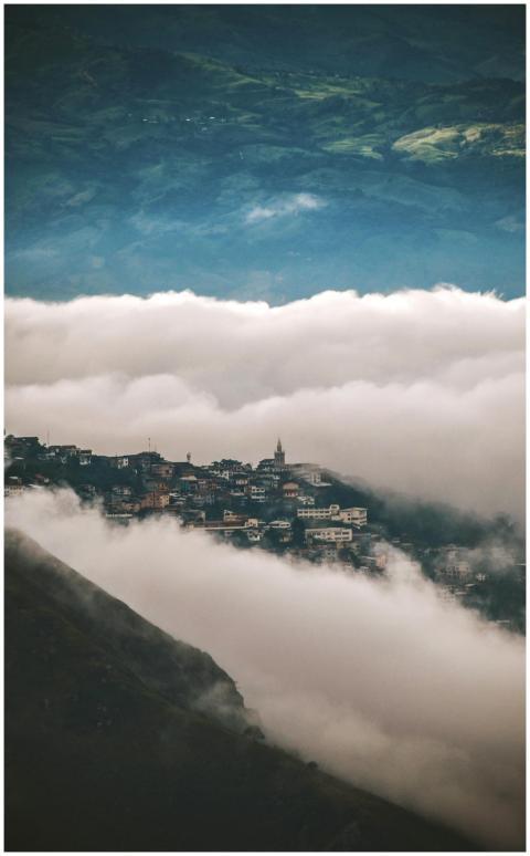Scenic view of Zaruma nestled in misty clouds amon