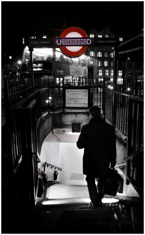 A dark, moody scene capturing a businessman enteri