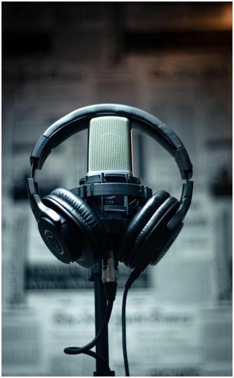Microphone with headphones in a studio environment