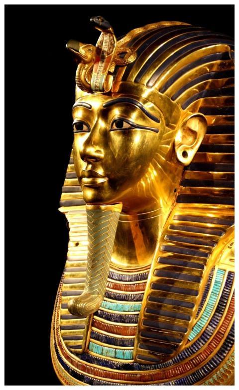 Close-up of Tutankhamun's gilded death mask showca