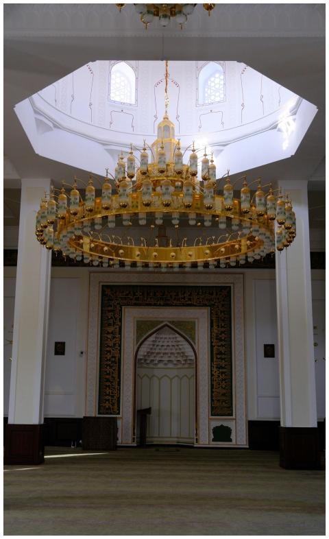 Elegant mosque interior featuring a large, intrica