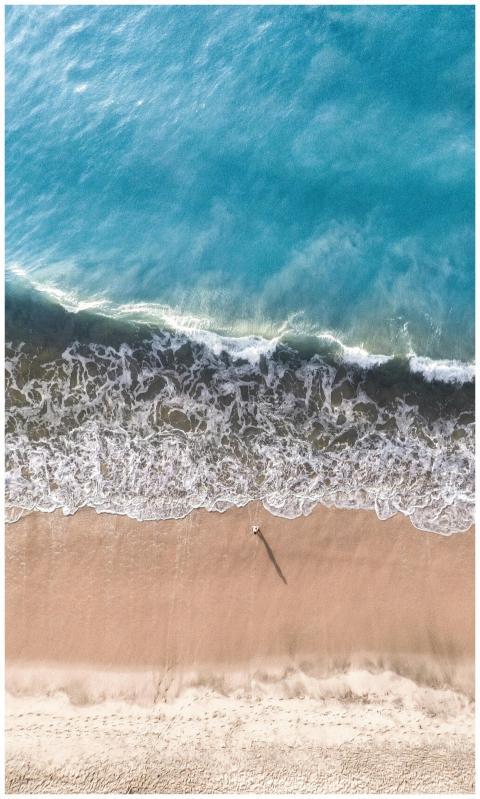 Vibrant aerial capture of Arugam Bay's sandy shore