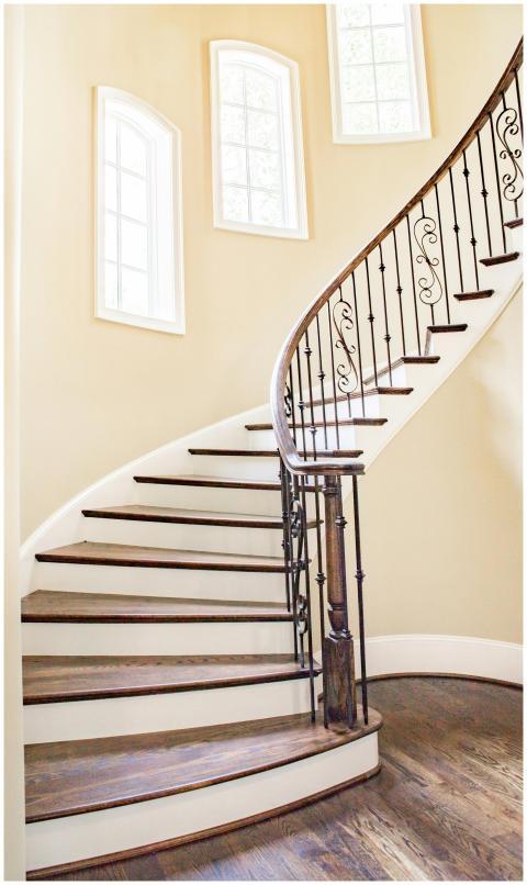 Beautiful spiral staircase with iron railings and