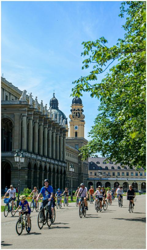 Group of people biking near architectural landmark