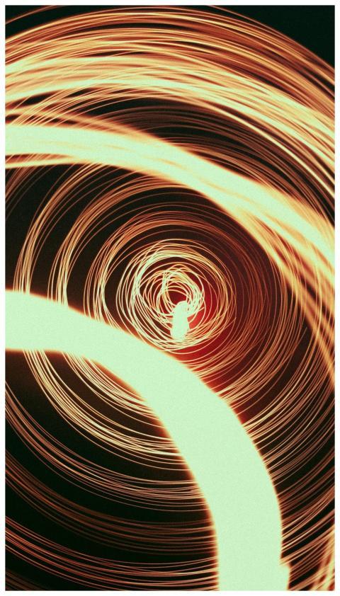 Dynamic light spiral pattern creating a vibrant an