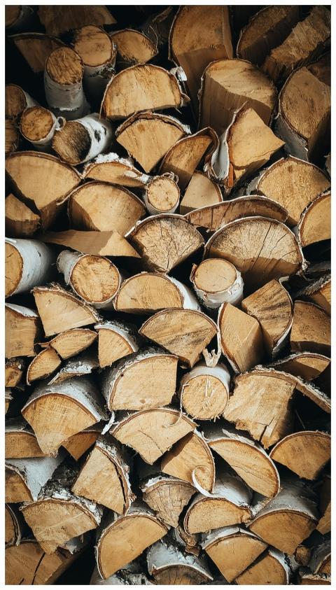 Close-up of a neatly stacked pile of chopped firew