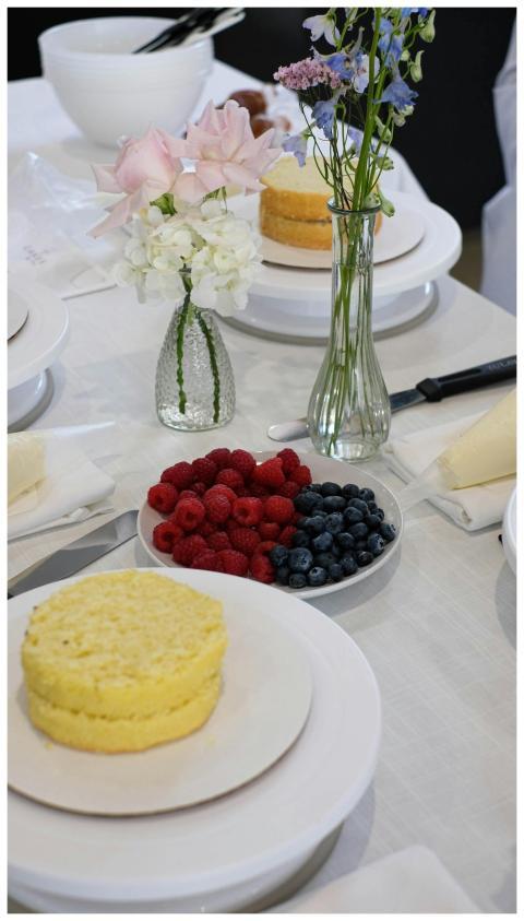 An elegant breakfast spread featuring cakes, fresh