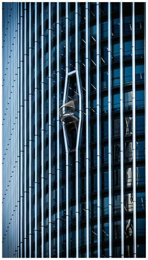 Reflective skyscraper in Madrid showcasing modern