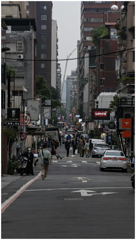Crowded city street lined with high-rise buildings