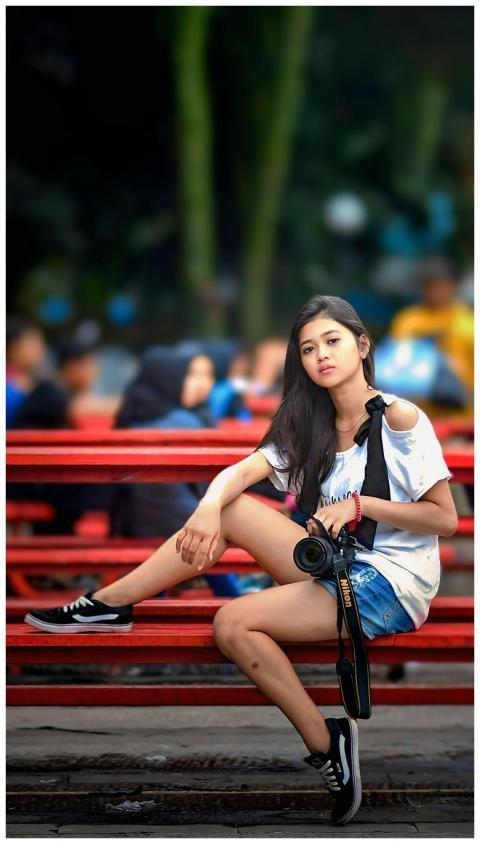 Young Woman Camera Sitting