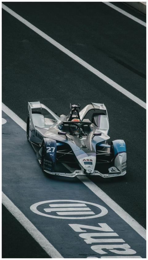 Dynamic shot of a Formula E race car on a race tra