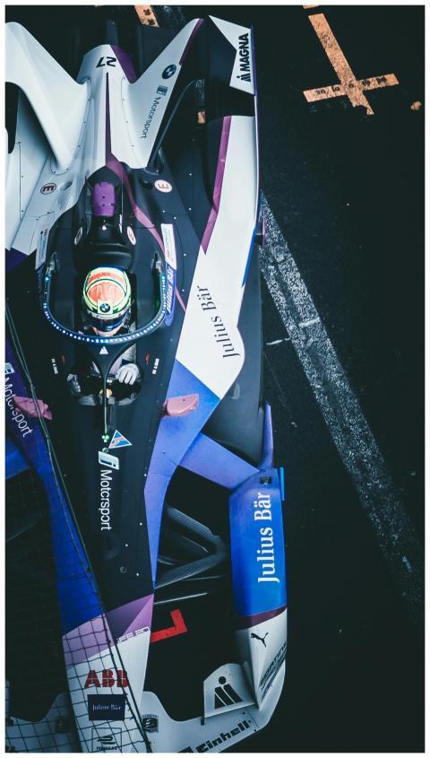 Dynamic aerial shot of a race car on the track at