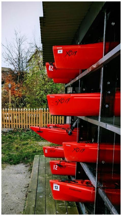 Red Kayaks Stacked Outdoors