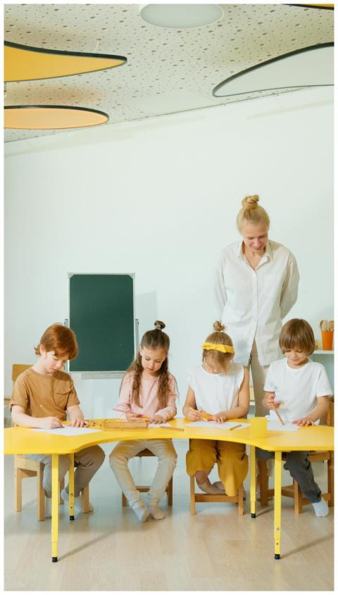 A group of children with a teacher engaging in edu