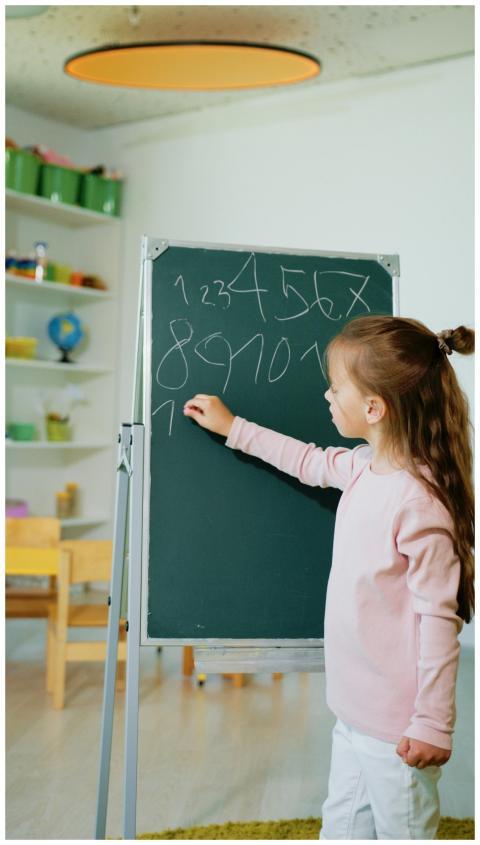 A girl engaging in educational learning by writing