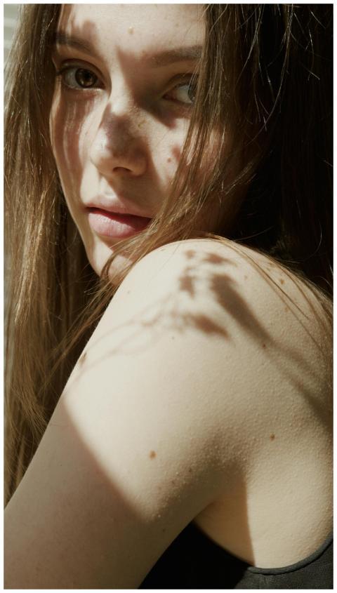 Portrait of a woman in soft natural light with sha