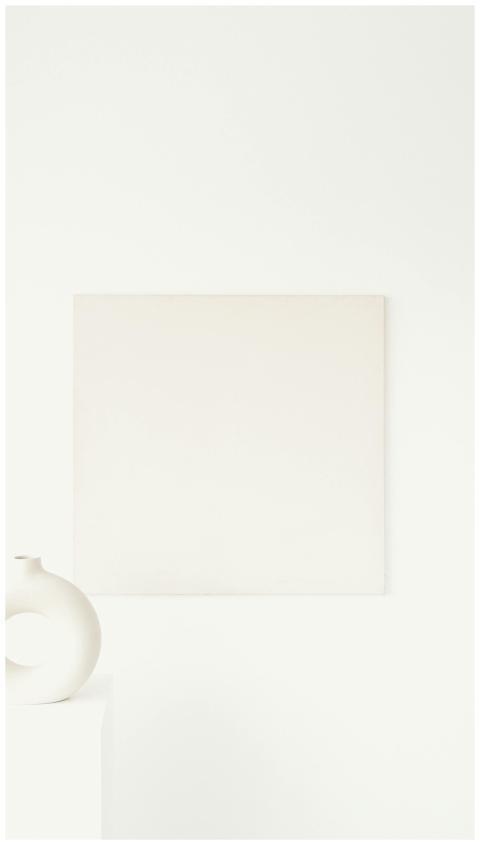 A minimalist interior featuring abstract art and a