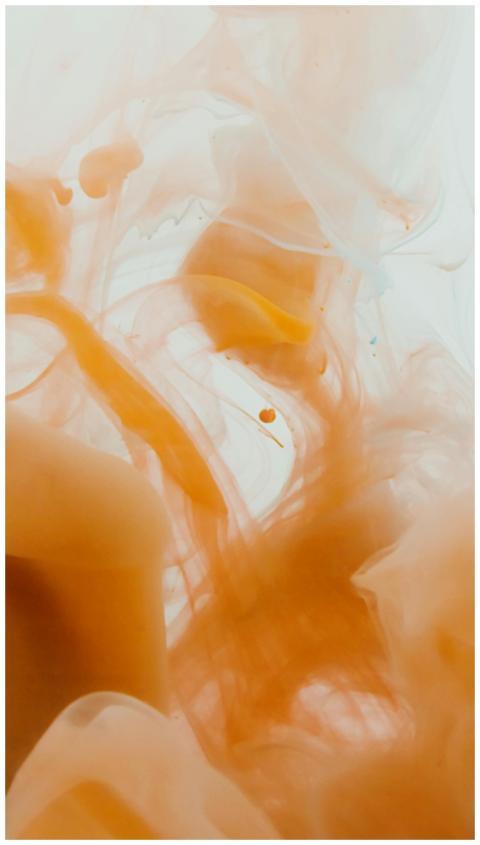 A vibrant abstract photograph of swirling orange a