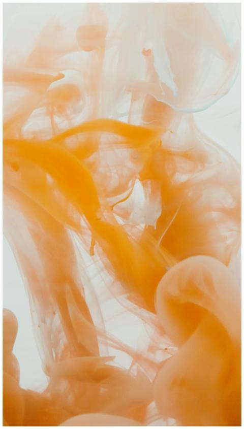 Abstract fluid art with orange swirls creating an