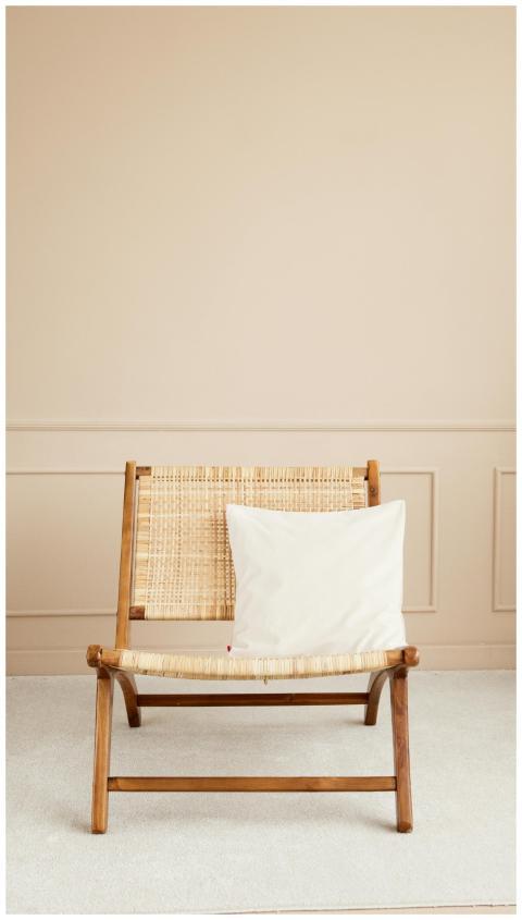 Cozy wooden chair with cushion in a modern minimal