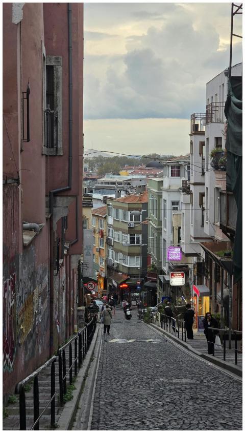 Charming cobblestone street lined with colorful bu