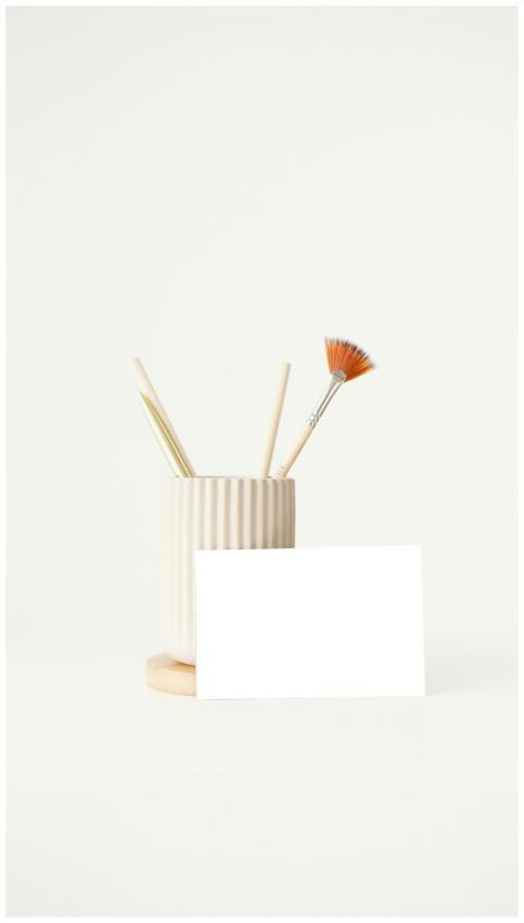 Elegant minimalist desk scene with ceramic holder