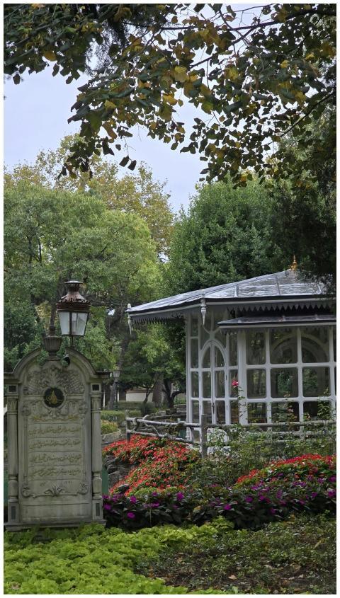 Tranquil garden with a white gazebo surrounded by