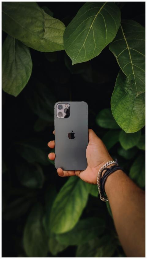 Close-up of a hand holding a sleek smartphone agai