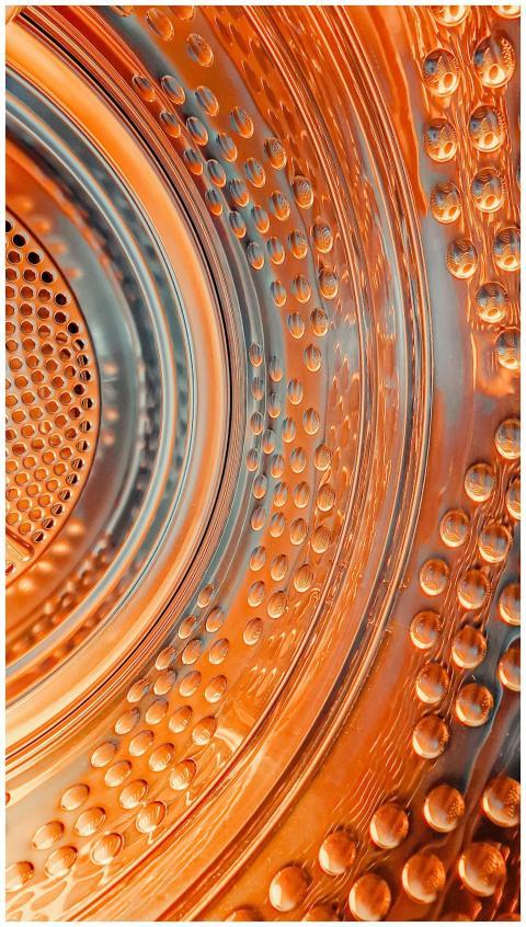 Dynamic close-up of a washing machine drum with vi