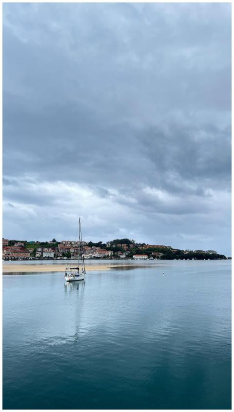 Sailboat floating peacefully near a charming seasi