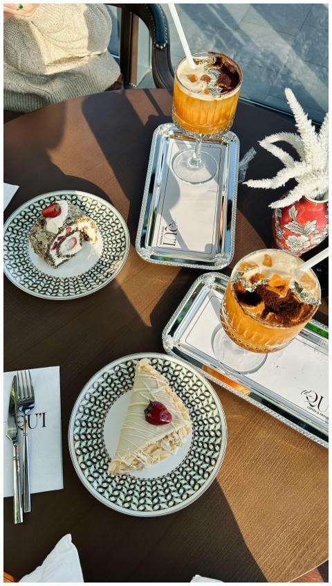 Elegant café table setting with iced coffee and de