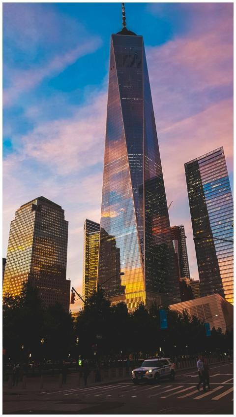 One World Trade Center reflecting sunset hues in N