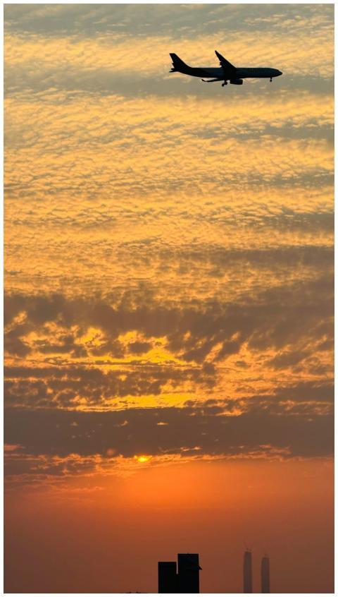 Airplane Silhouette Against Vibrant