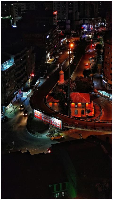 Vivid aerial night view of a bustling urban overpa