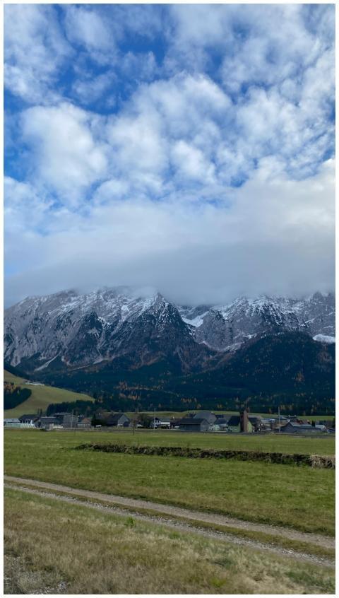 Picturesque alpine village with majestic snow-cove