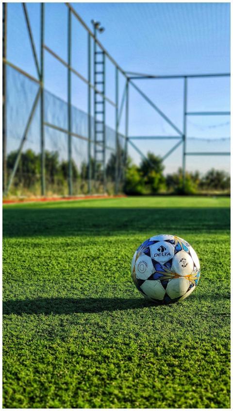 Vibrant photo of a soccer ball on an outdoor field