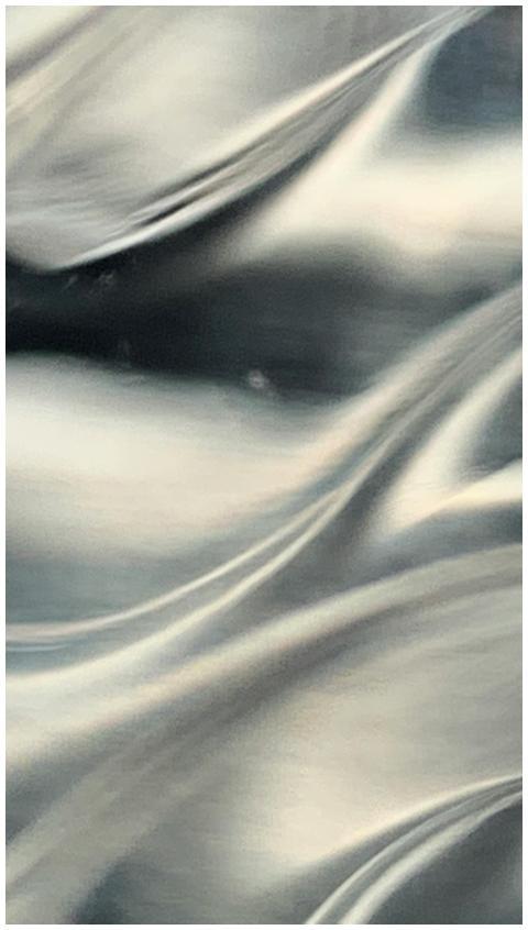 Close-up of abstract metallic silver fabric textur