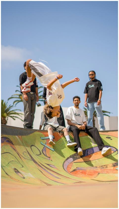 Dynamic photo of a skateboarder flipping mid-air a