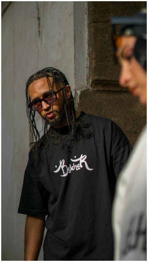 Stylish young adults in sunglasses and graphic t-s