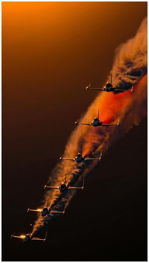 Spectacular aerobatic jet formation with smoke tra