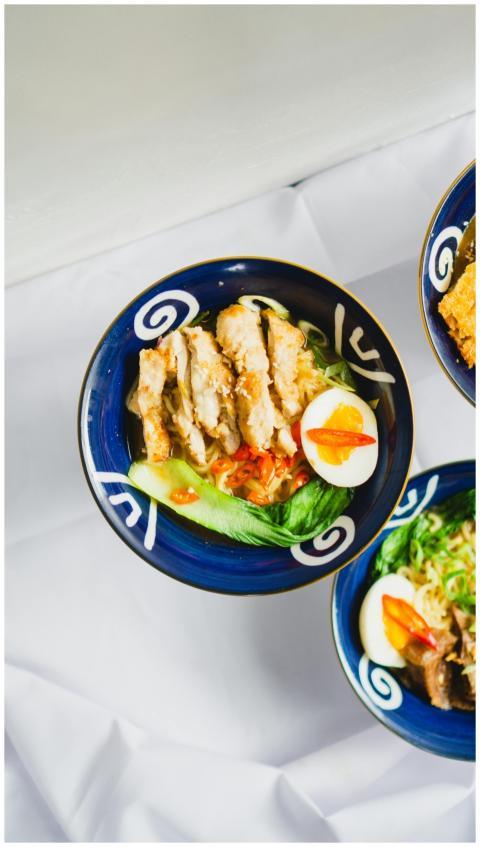 Top view of a savory chicken ramen bowl with vibra