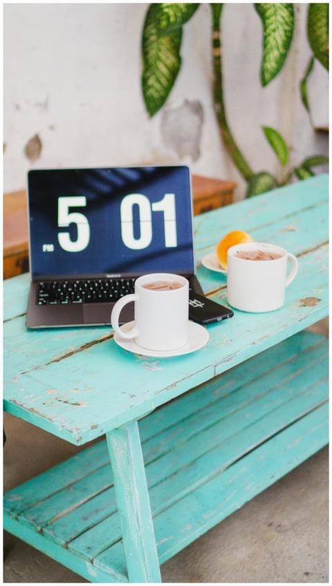 A tranquil workspace setup with coffee mugs and a